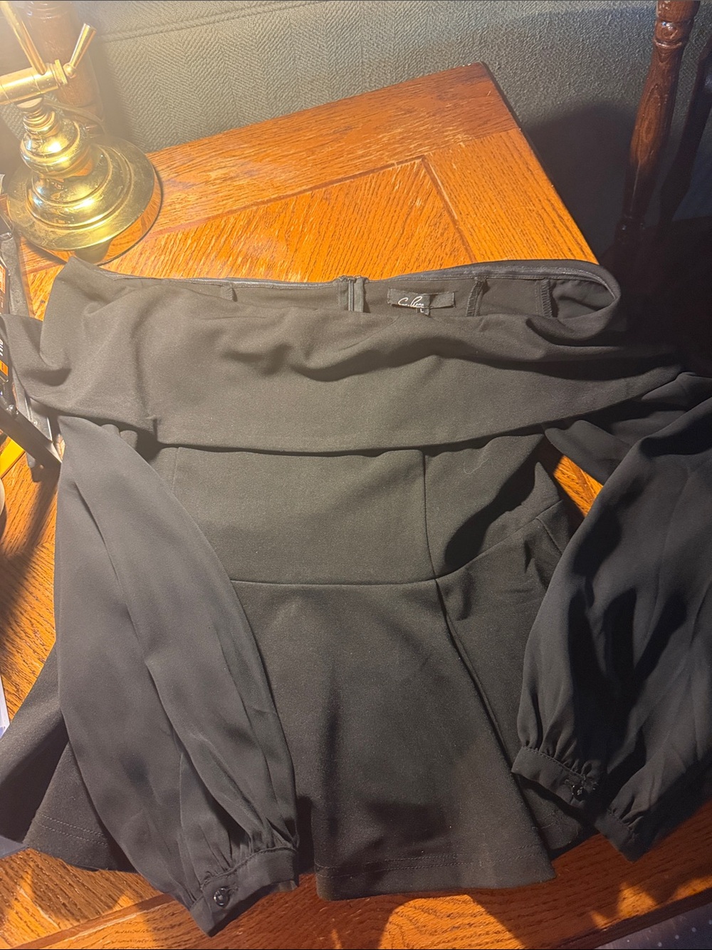 C. Luce Black Women's Top with Branded Neck Label